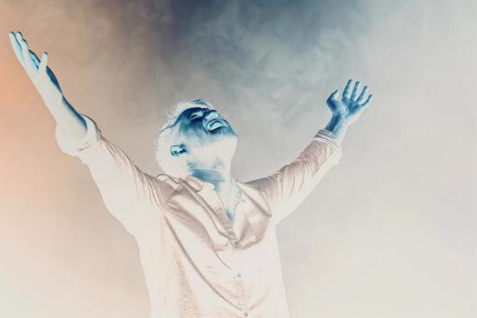 A worshipper with hands lifted in prayer during the Clash of Kingdoms prayer portal